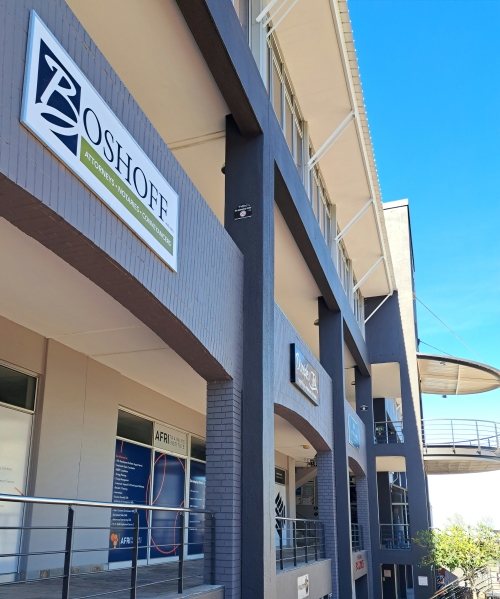 Sign outside of offices used by Boshoff Attorneys, Notaries & Conveyancers.